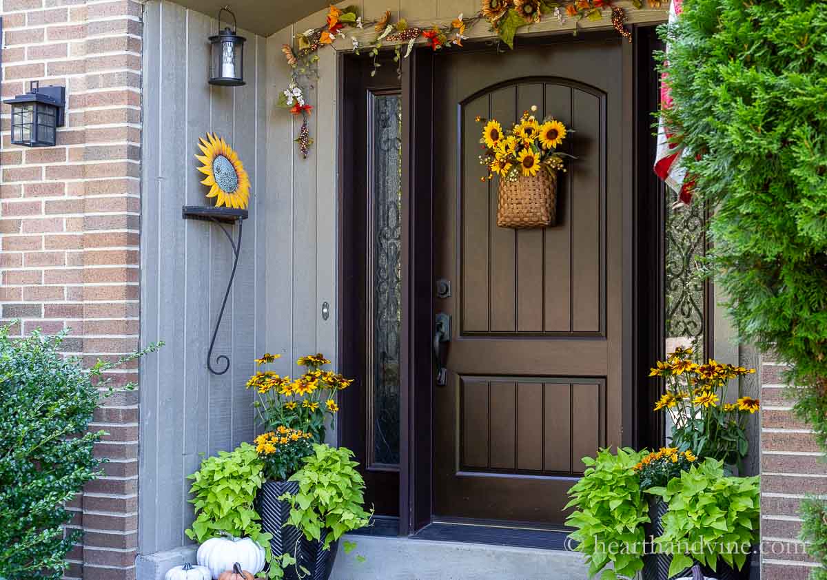 Side view of fall decorated porch with a sunflower theme.