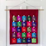 Felt advent calendar on the wall.