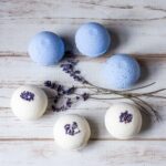 Three blue and three lavender bath bombs.