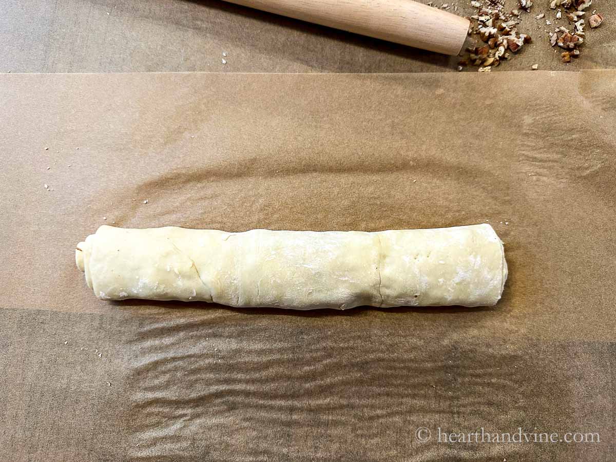 Puffed pastry and ingredients rolled up.