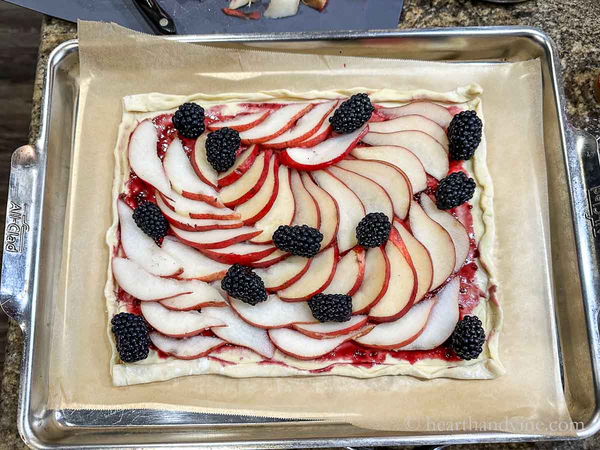 Pears and blackberries on puff pastry brushed with blackberry reduction.