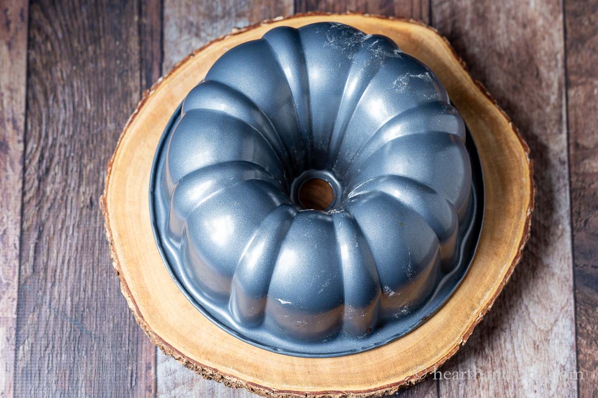 A bundt pan turned over onto a platter to release the cake.