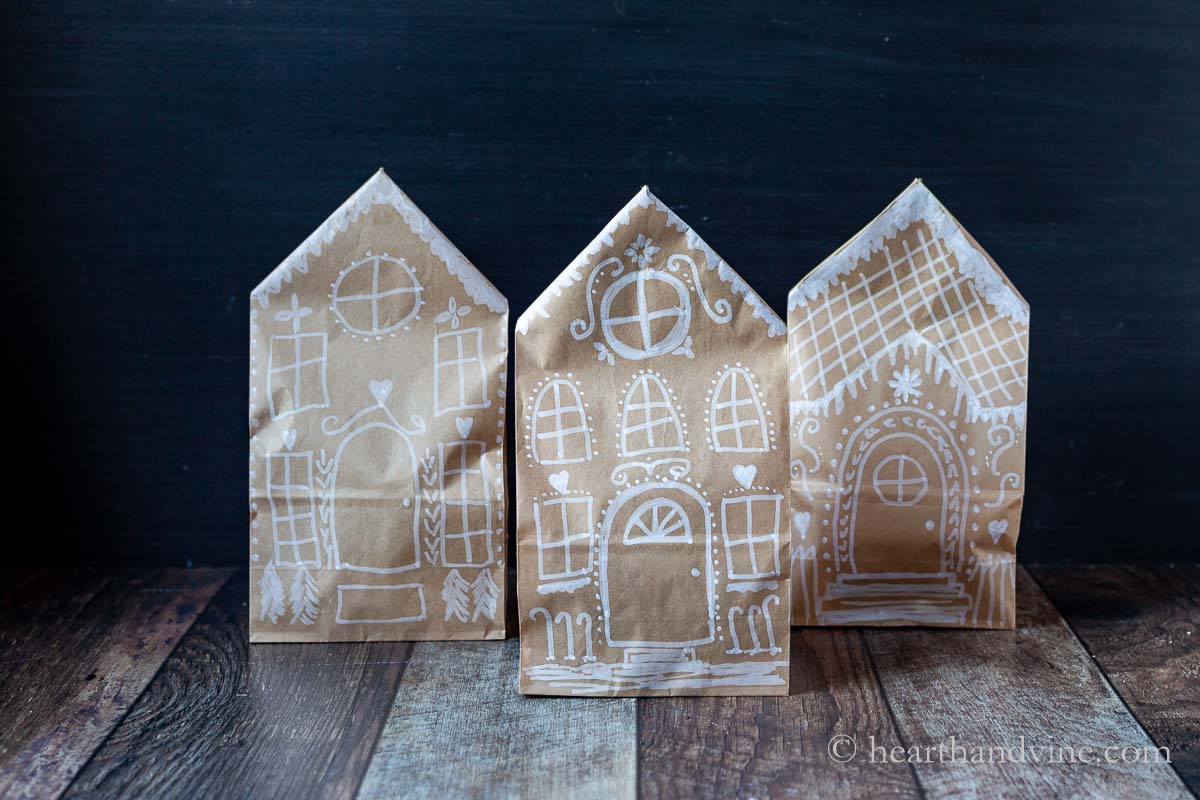A trio of three different paper bag gingerbread houses.