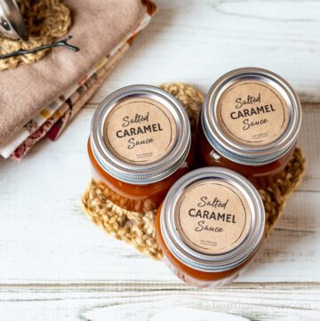 Three jars of salted caramel sauce with labels.