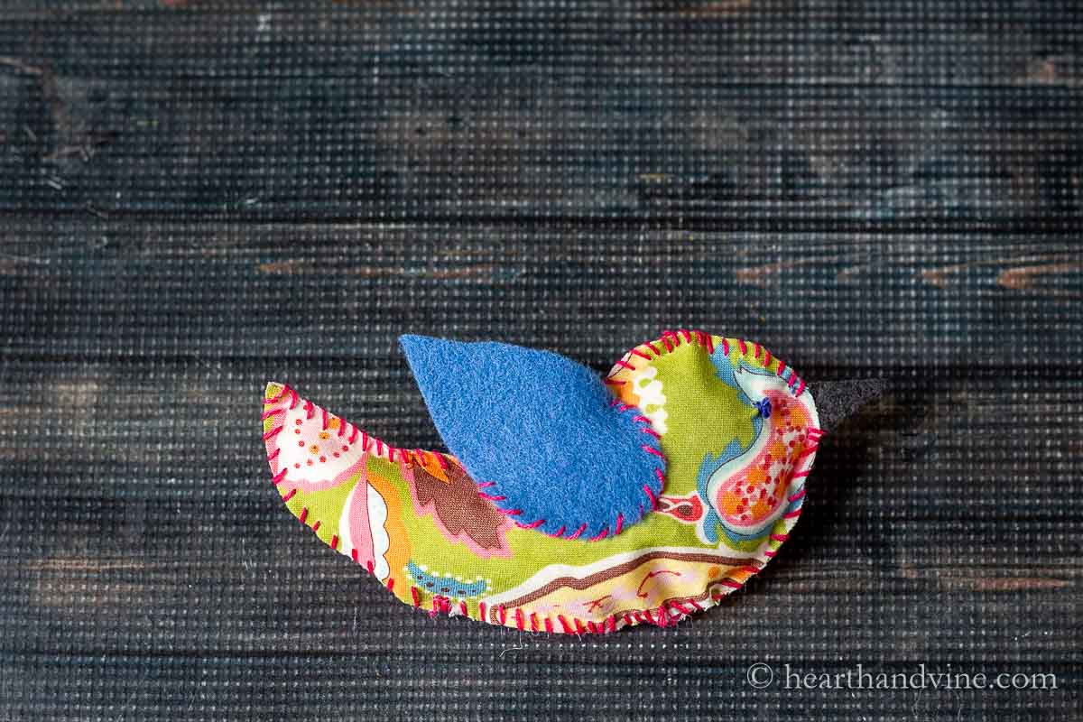 A completed fabric bird on the table.