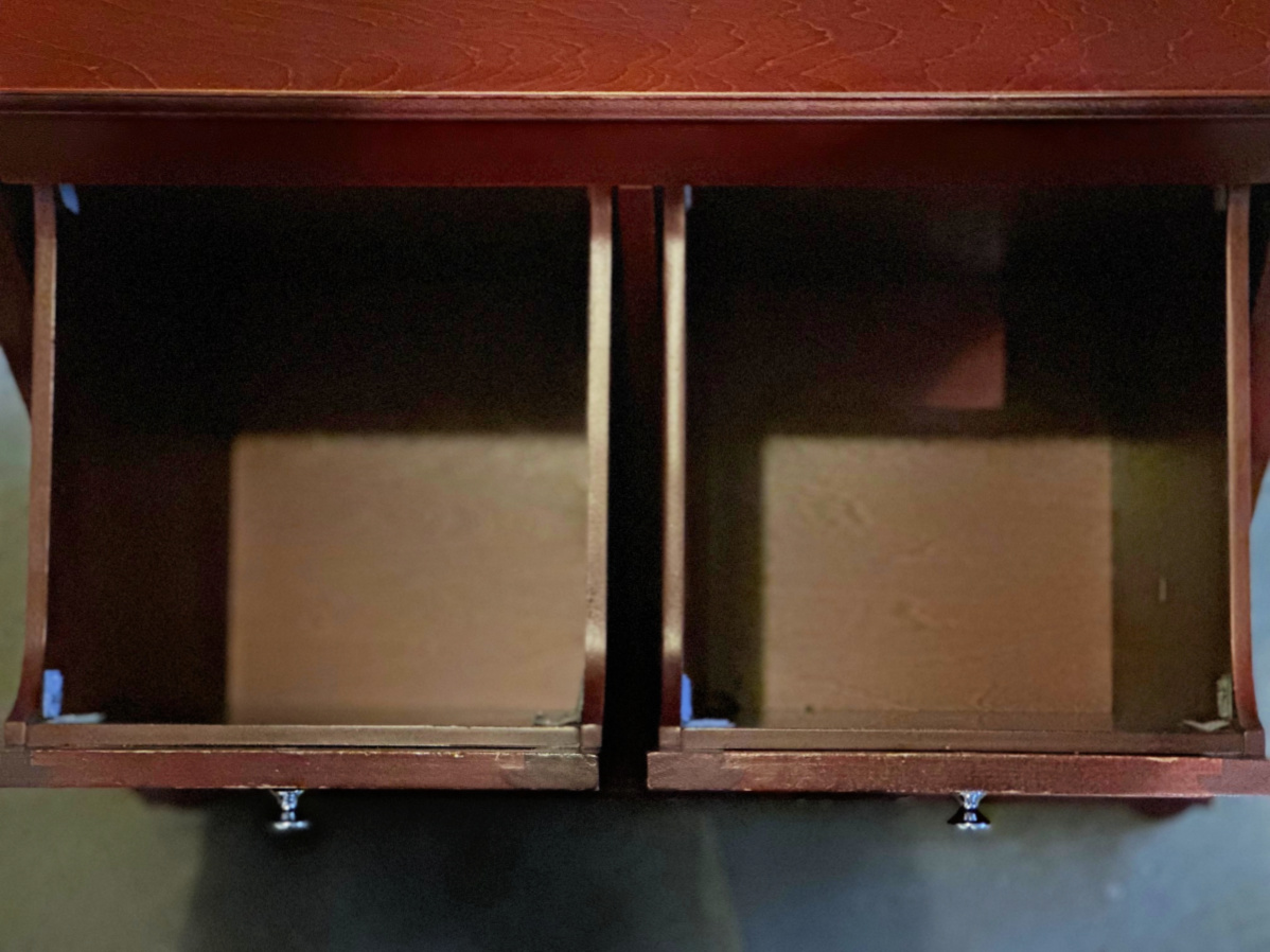Inside bins of red/brown cabinet.