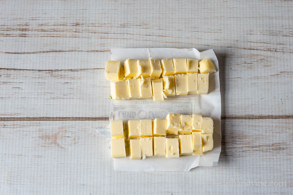 Cut up cubes of butter.
