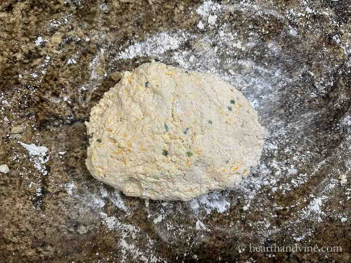 Biscuit dough on floured surface.