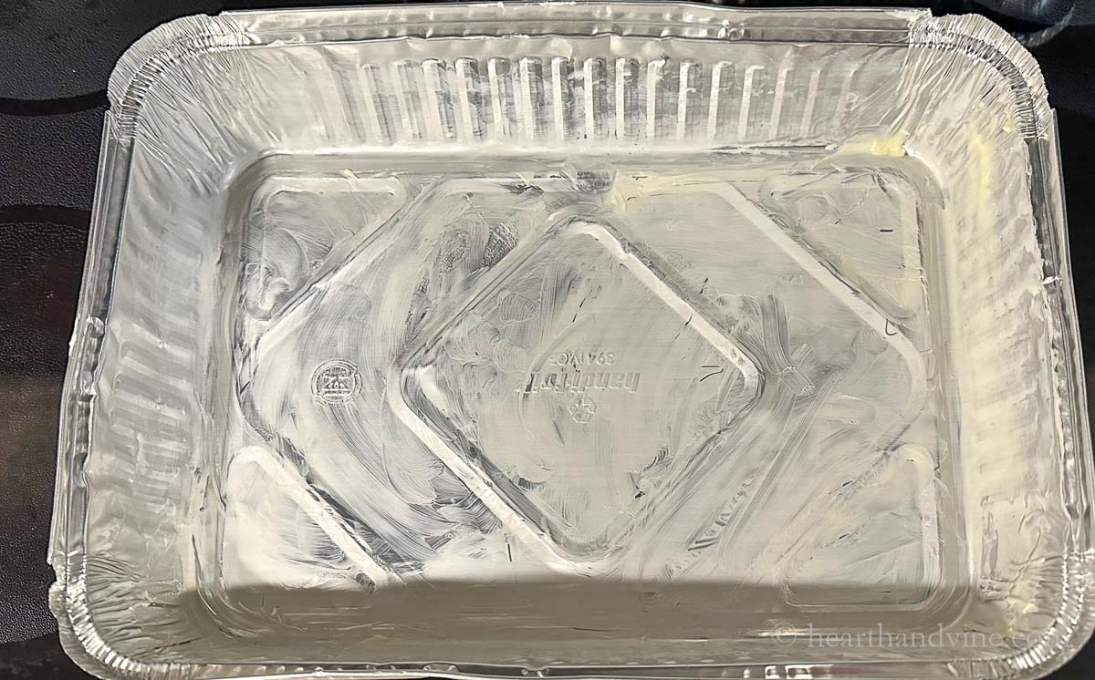Aluminum pan greased with butter.