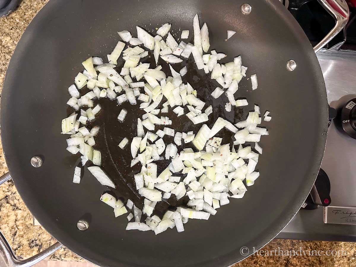 Chopped onion sauteing on the stove in a little olive oil.