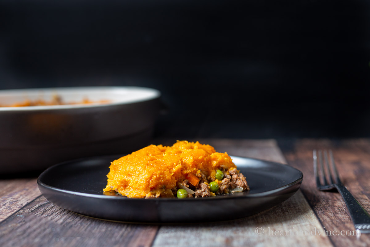 A serving of shepherd's pie with sweet potatoes on a plate.