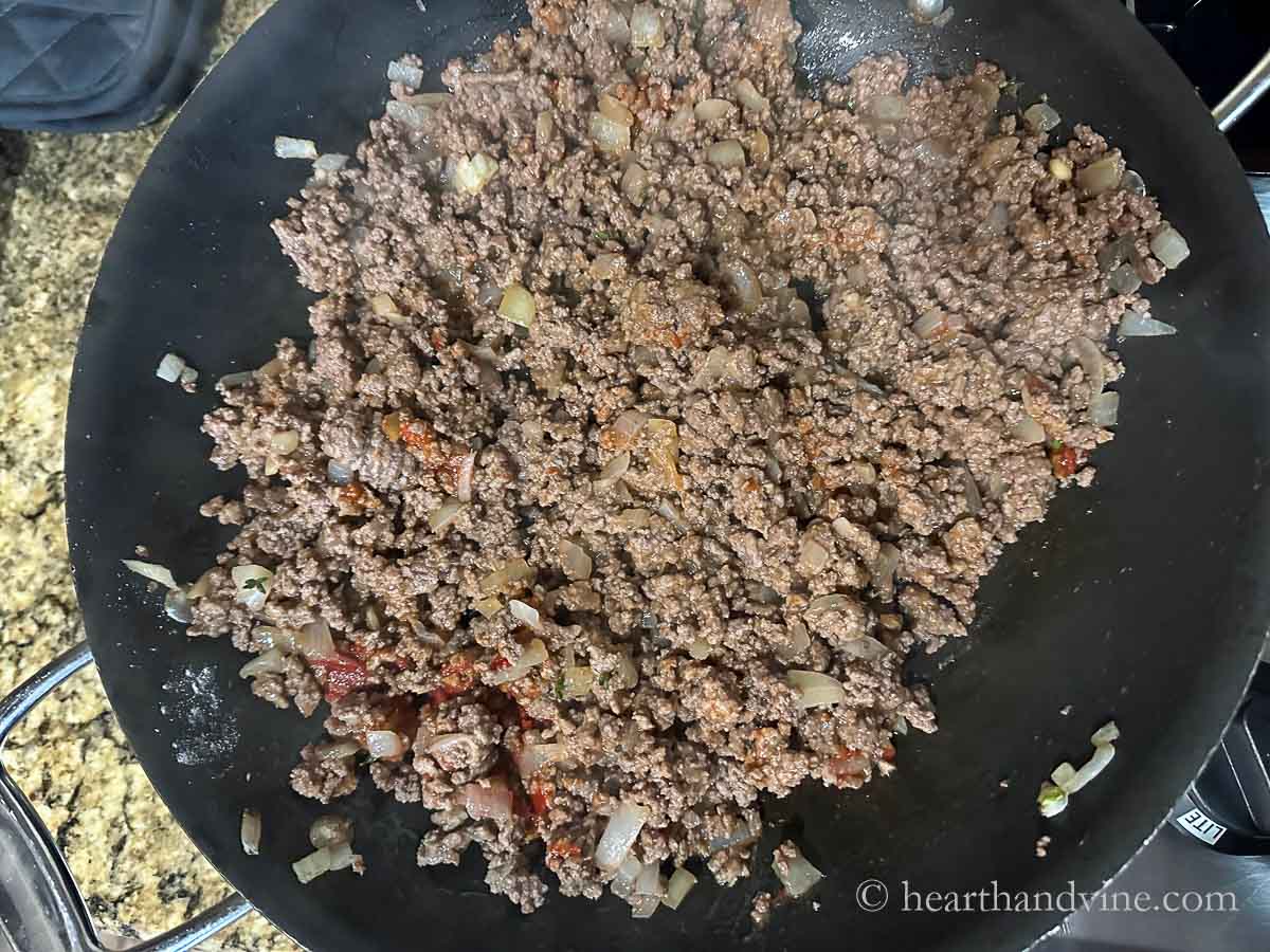 Ground beef mixture with tomato paste added.