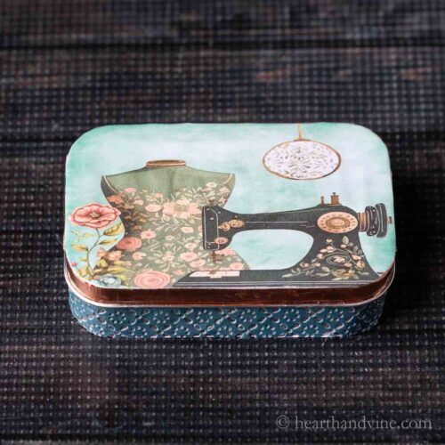 Altoid tin sewing kit with vintage sewing print cover.