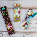 Three sized nail file holder in three different fabric.