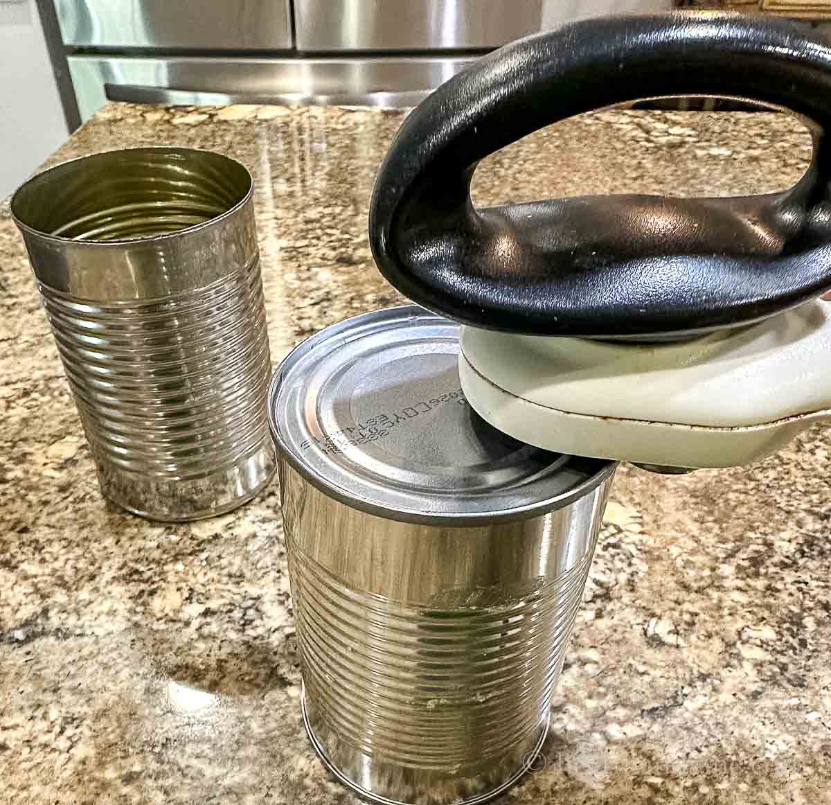 Removing both ends of a can with a smooth edge can opener.