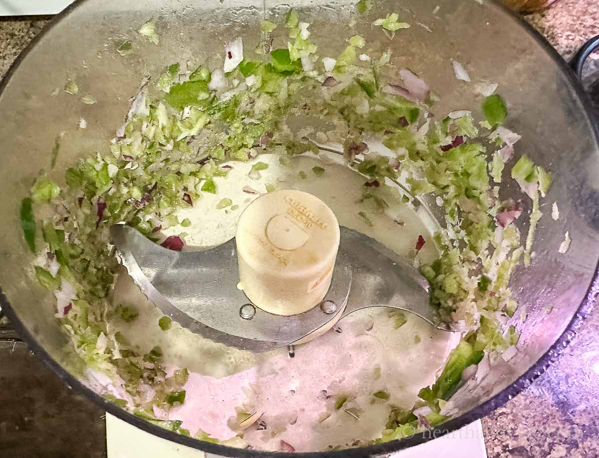 Onion and peppers chopped in a food processor.