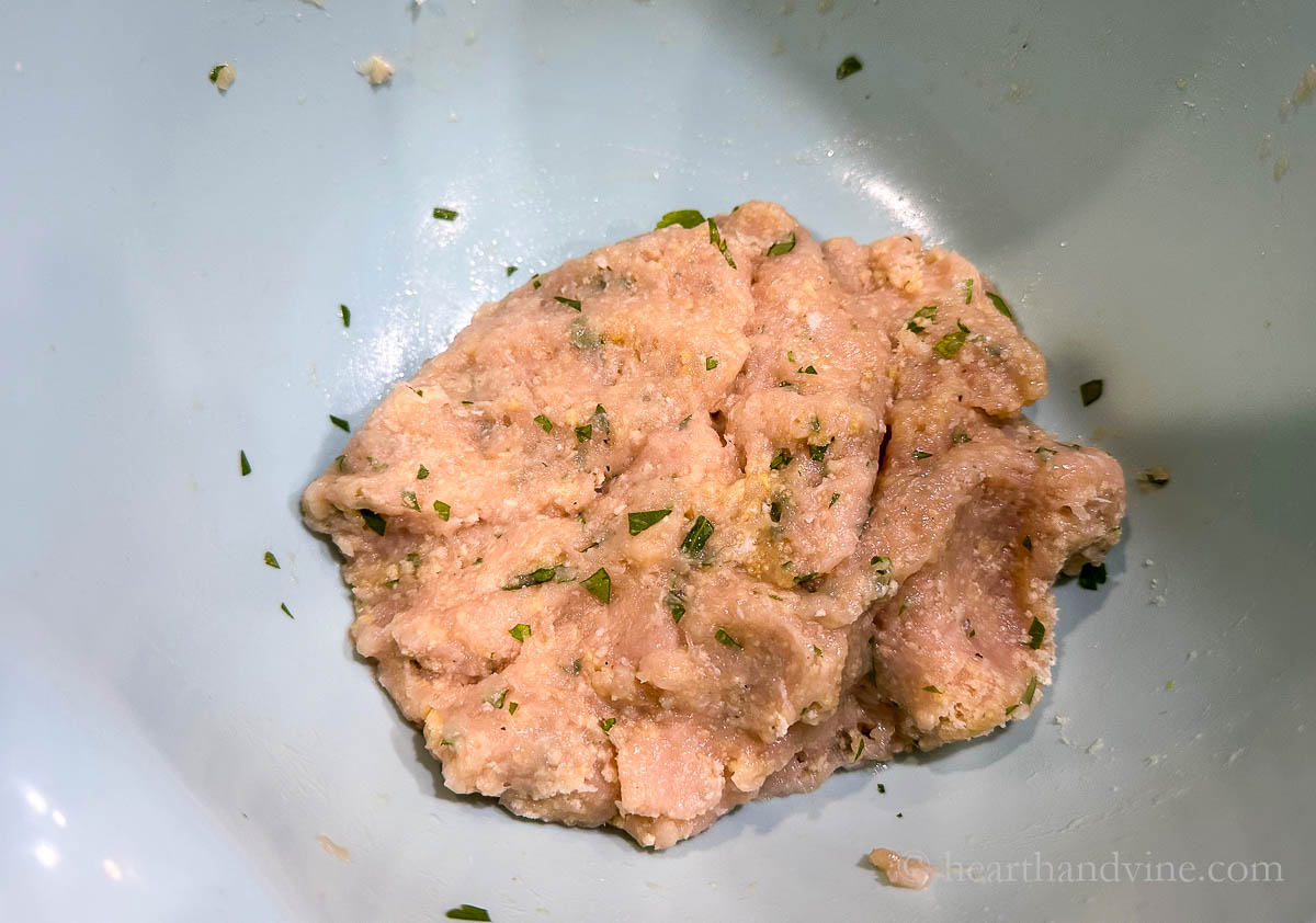 Meatball mixture in a large mixing bow.