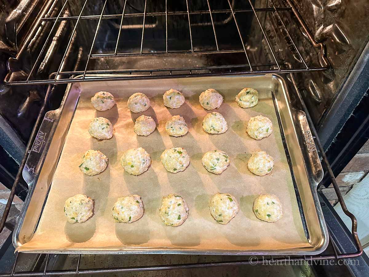 Cooked meatballs coming out of the oven.