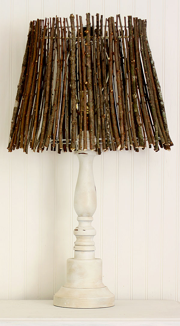 Lamp with a twig lamp shade.