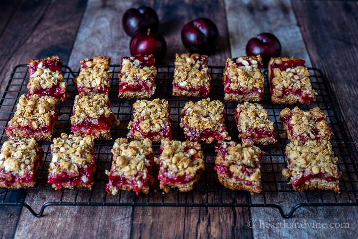Plum cobbler bars cooling on a wire rack.