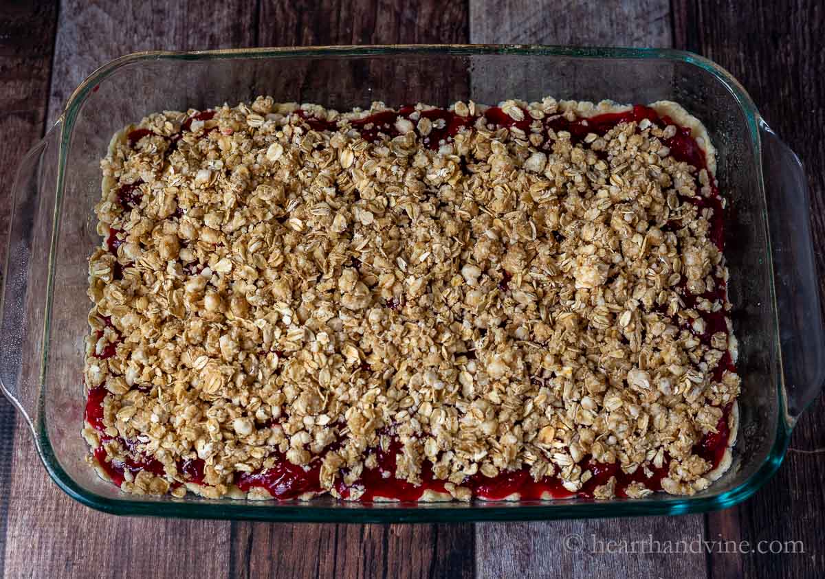 Crumble topping on top of plum filling.