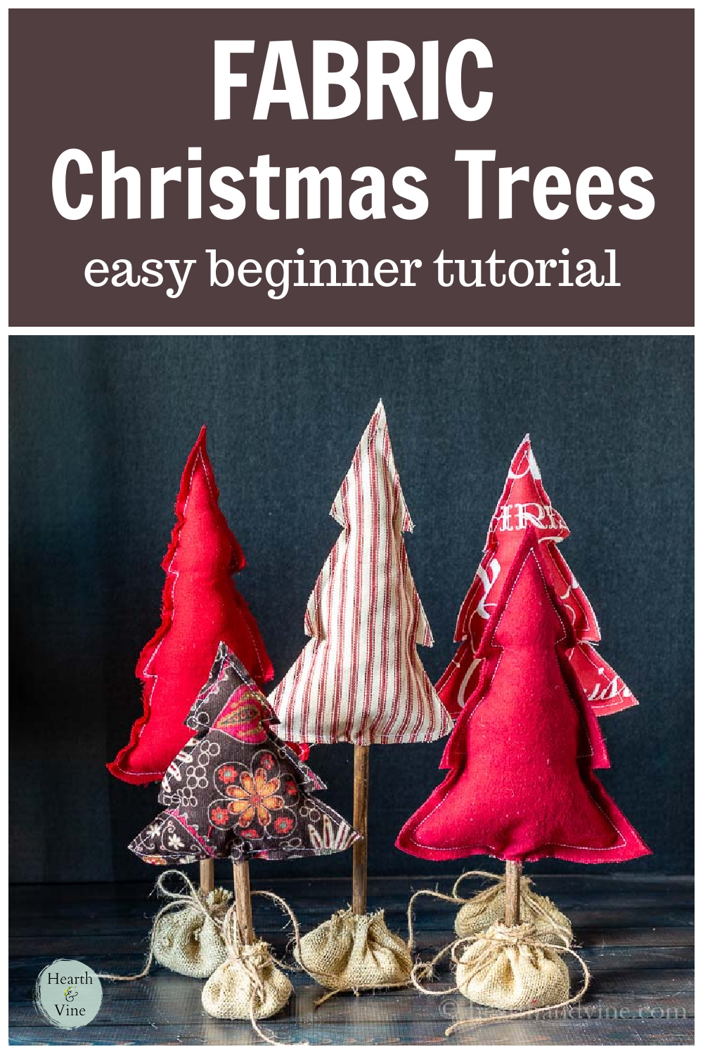Five fabric stuffed Christmas trees for the table in shades of red.