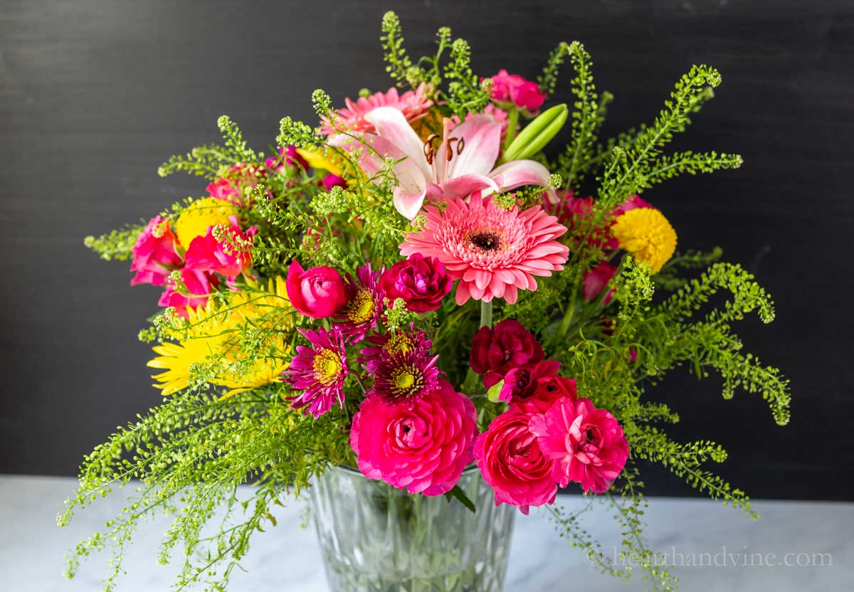 Flower arrangement after three days showing full bloom flower heads.