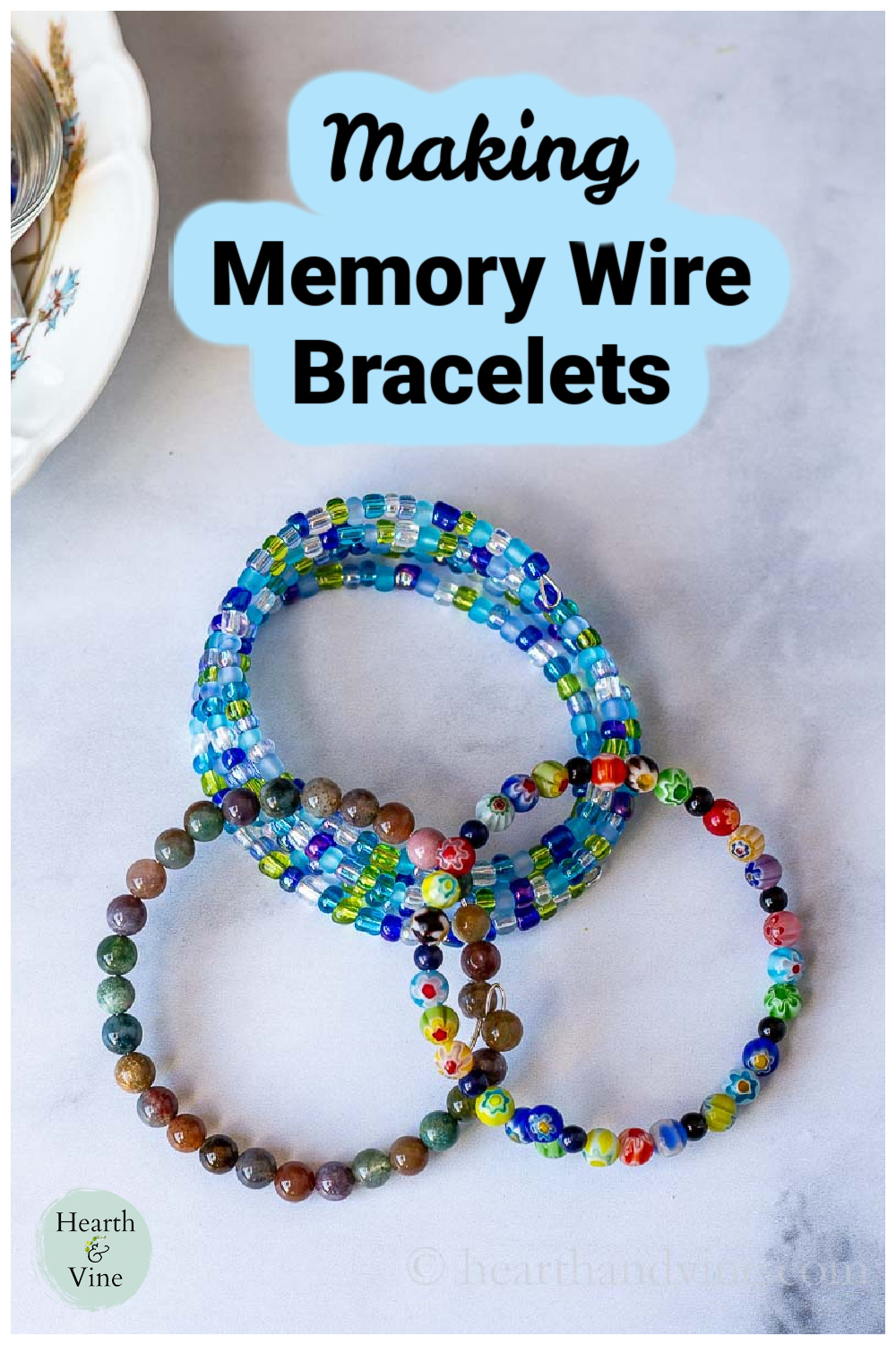 Three different memory wire bracelets in multiple colors and lengths.