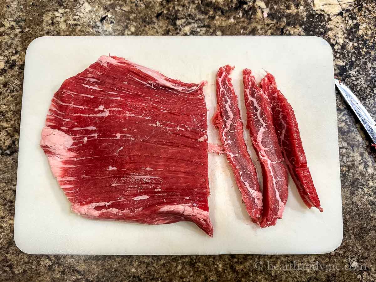 Flank steak sliced into thin strips.