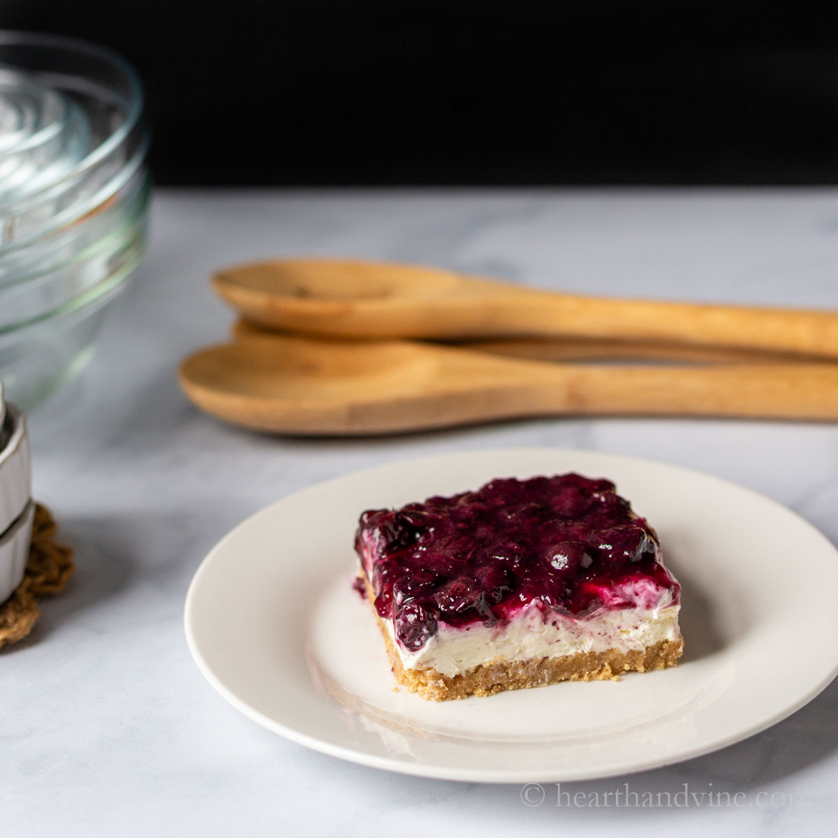 Individual serving of blueberry cheesecake bars.