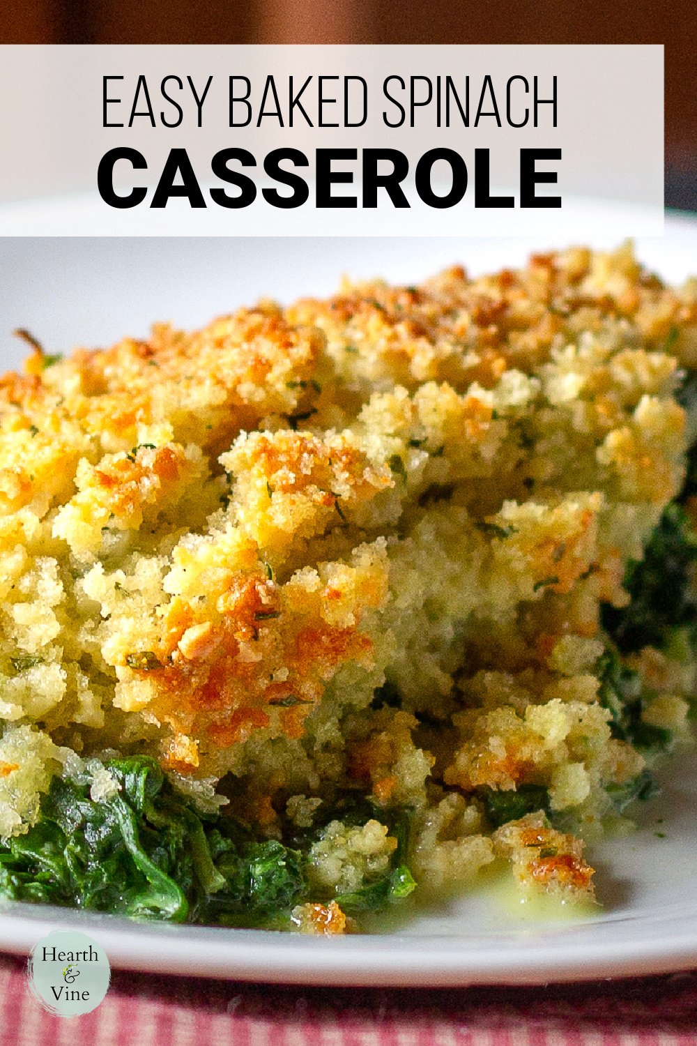 Serving of cheesy creamy spinach casserole.