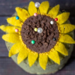 Aerial view of a felt sunflower pin cushion.
