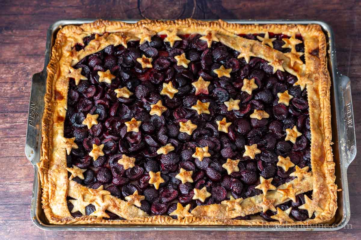 Aerial view of the full cherry slab pie after being baked in a jelly roll pan.