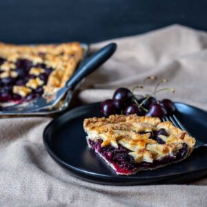 Corner slice of cherry slab pie.
