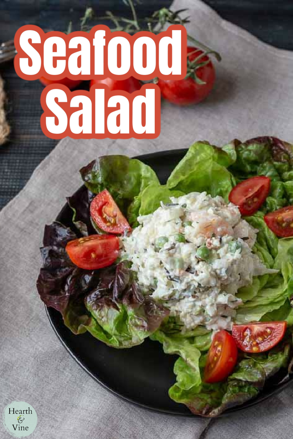 Seafood salad with crabmeat, shrimp and wild rice on a bed of lettuce with cherry tomatoes.