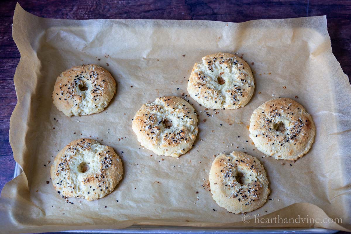 Bagels on a baking sheet out from the oven.