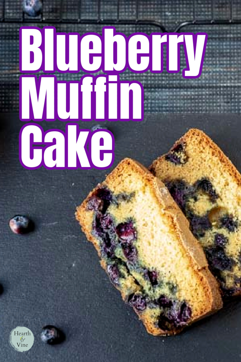 Slices of blueberry muffin cake and a few fresh berries scattered around.
