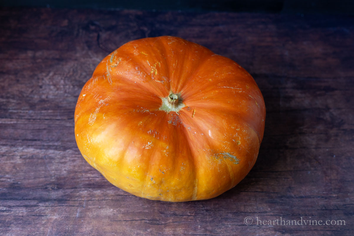 A whole orange-red fantasy pumpkin.