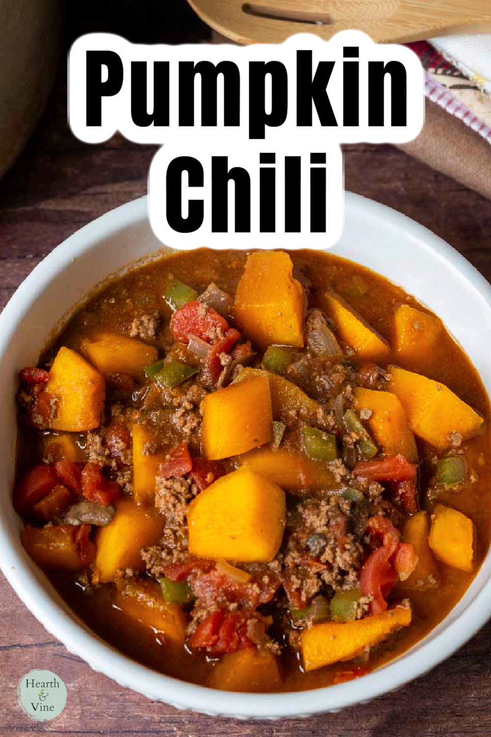 Close up of pumpkin chili with chunks of fresh pumpkin and no beans.