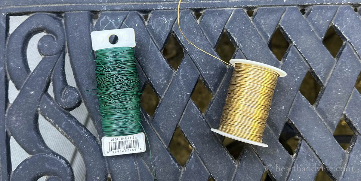 Spools of gold wire and green floral wire.