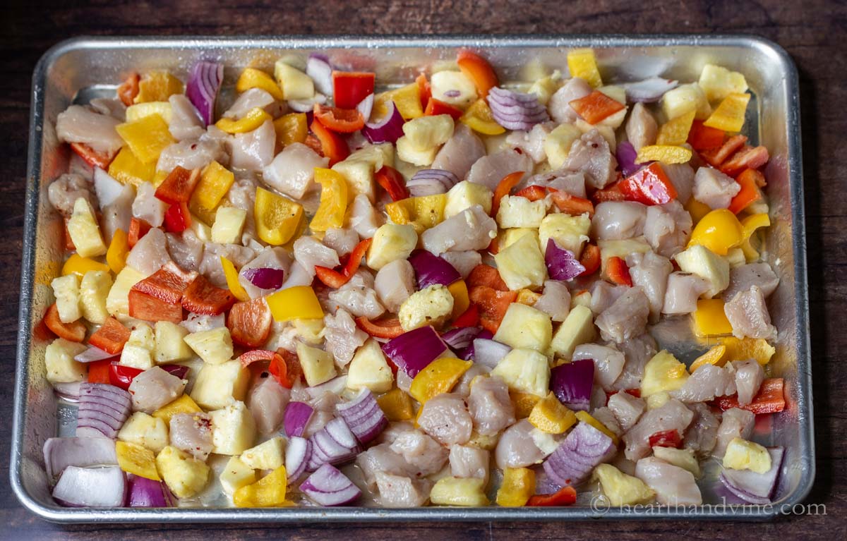 Hawaiian chicken sheet pan dinner before going into in the oven.