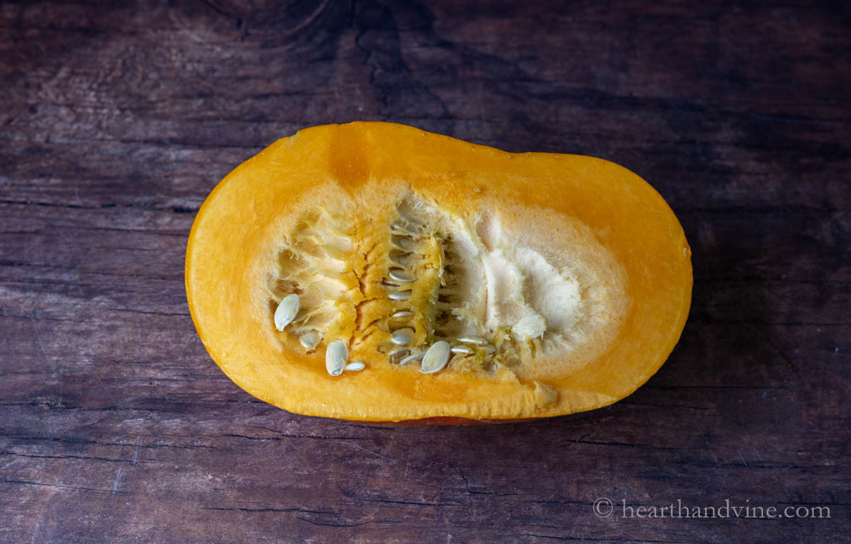 Cut fantasy pumpkin showing inside pumpkin and seeds.