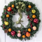 Williamsburg fruit wreath on a white door.