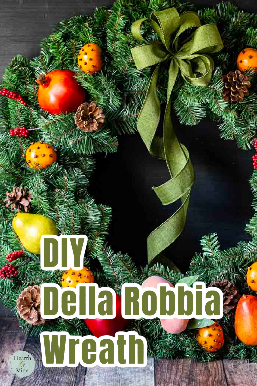 Partial view of a Williamsburg fruit wreath with a green bowl.