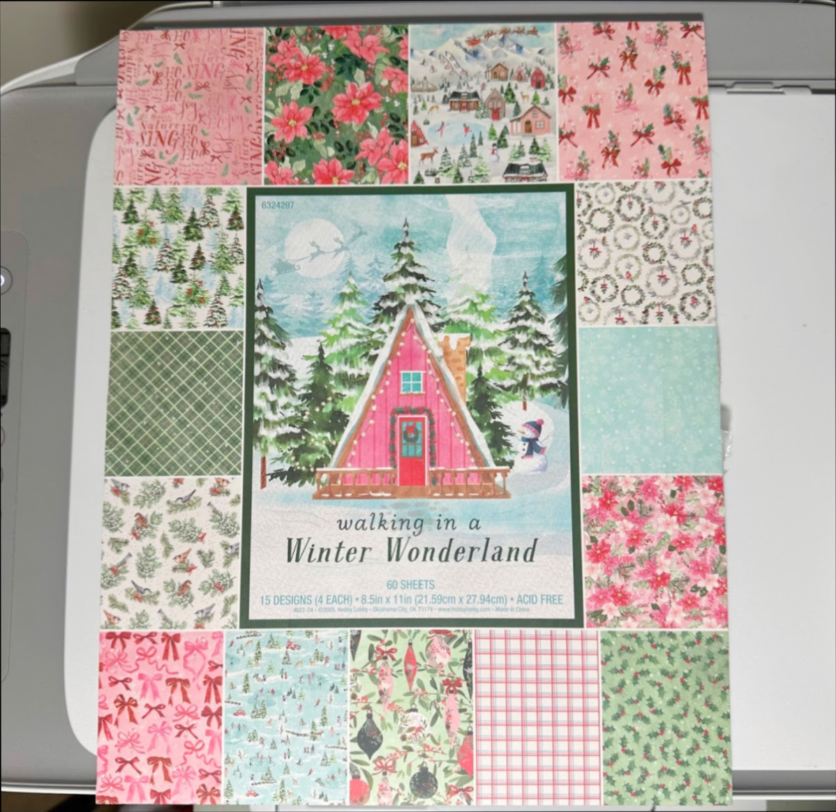 An image of a holiday book of printed scrapbook paper.