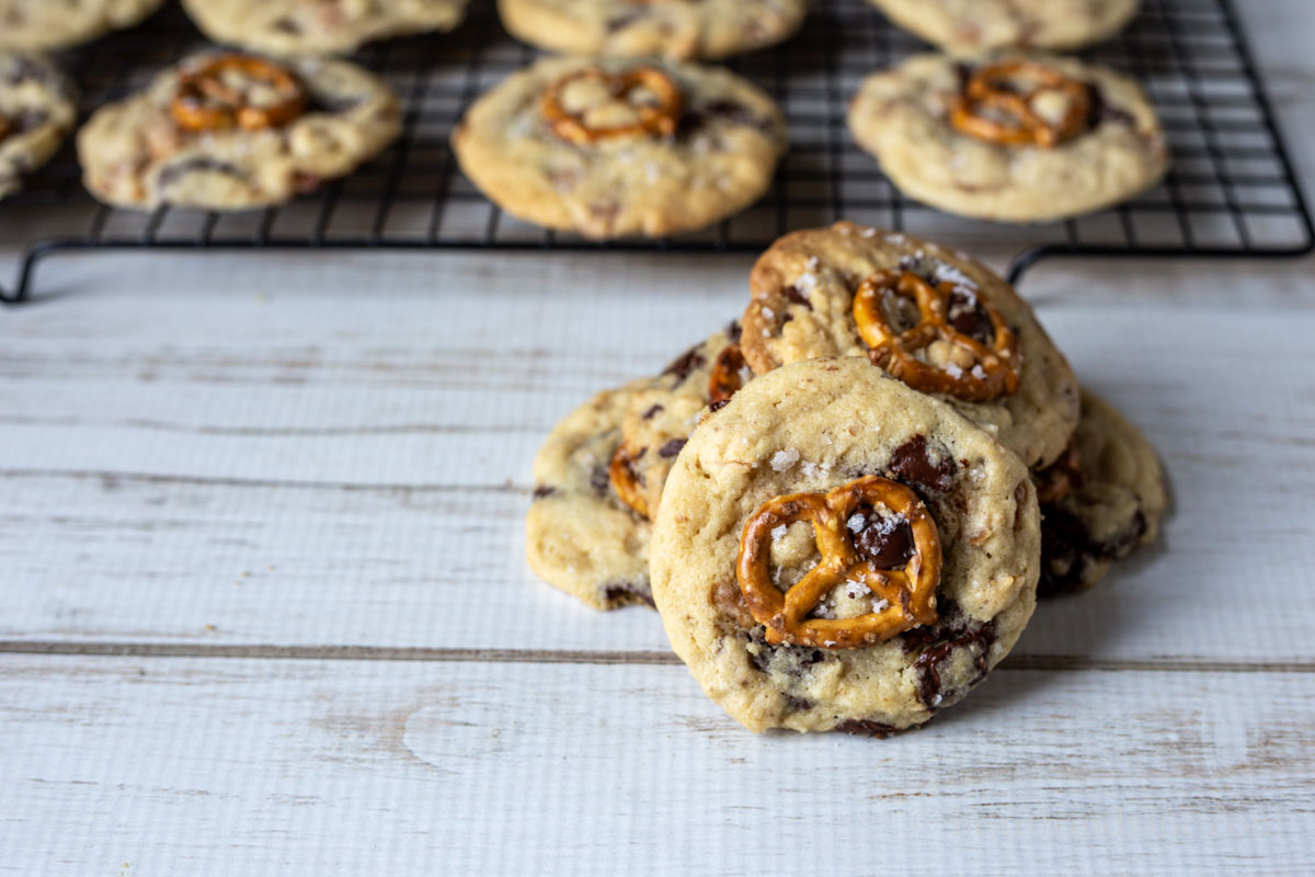 Chocolate chip caramel pretzel cookie stack with one facing forward.
