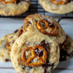 Chocolate chip cookies with a small pretzel in the middle.