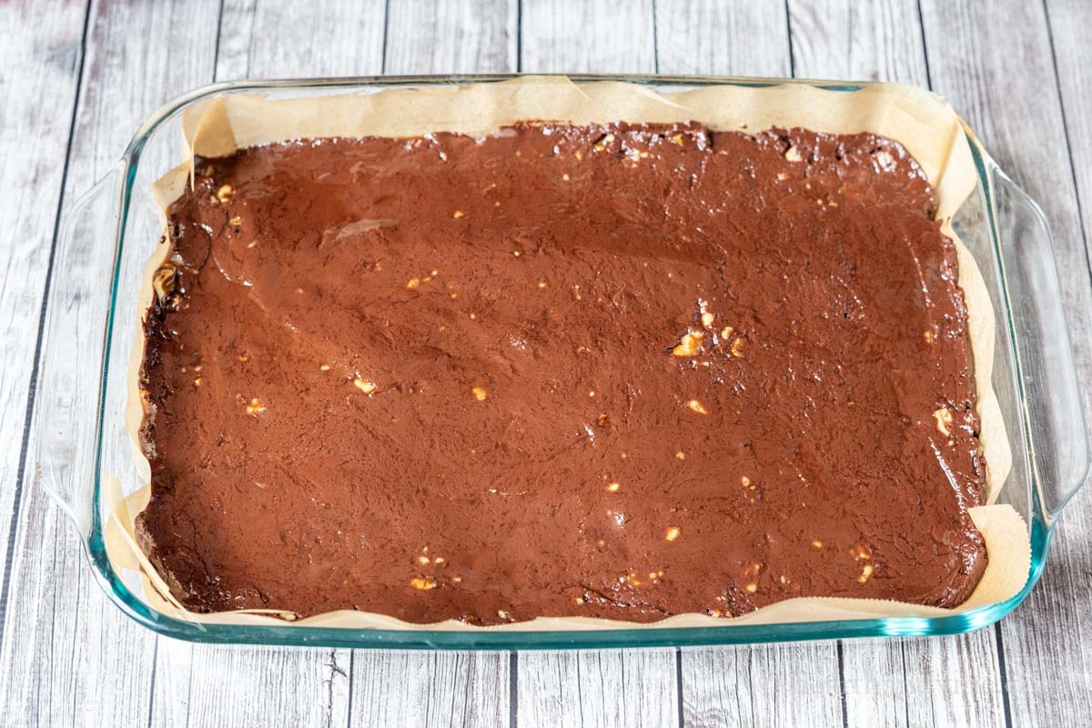 Fudge just poured into a parchment lined baking pan.