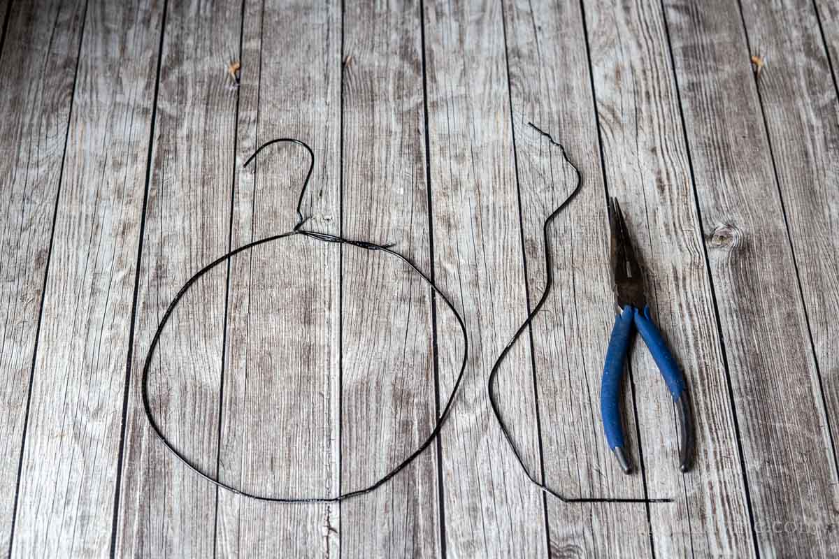 A wire coat hanger cut down and molded into a circle.