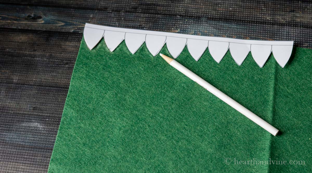 Leaf shape banner template traced onto the edge of felt.